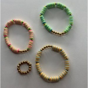 3 bracelets and 1 ring main colors are orange gold pink and green!